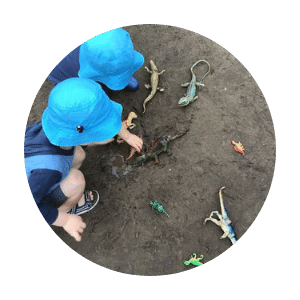 children-playing-dinosaurs-outside